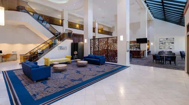 Spacious conference room with modern decor at Embassy Suites Santa Clara for events.