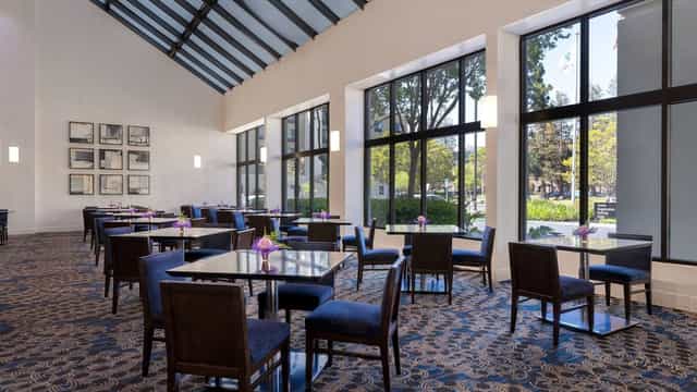 Conference room at Embassy Suites Santa Clara with natural light for meetings and events.