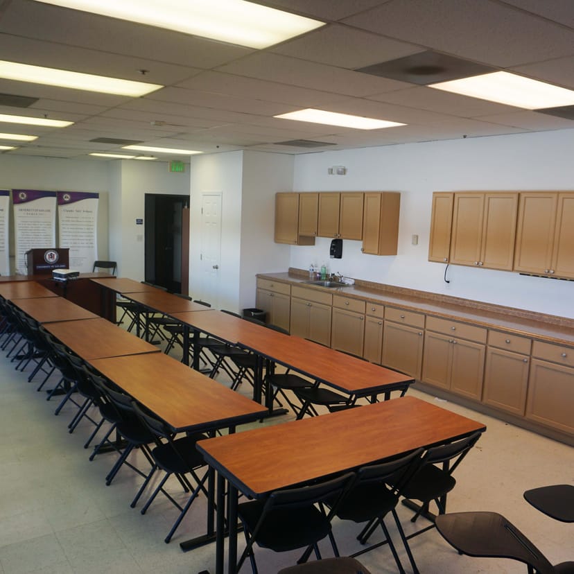 Versatile U-shaped meeting space in Urban Sanctuary San Jose for workshops and discussions.