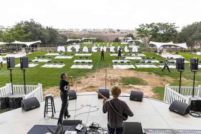 Wedding Weekend setup at Bliss Beach with vibrant seating for METACHELLA event.
