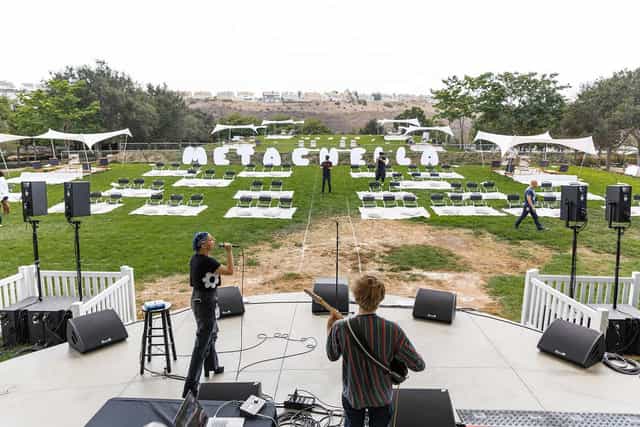 Wedding Weekend setup at Bliss Beach with vibrant seating for METACHELLA event.