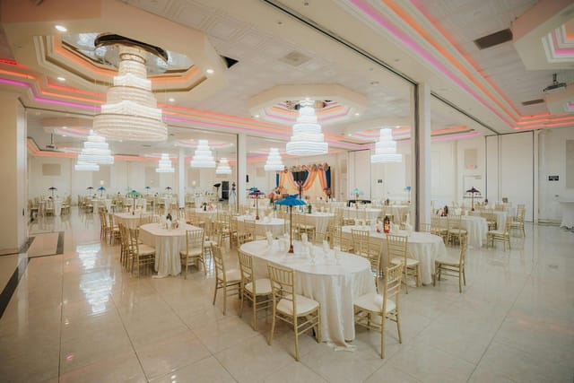 Grand Ballroom at Oasis Palace with elegant chandeliers, perfect for formal events.