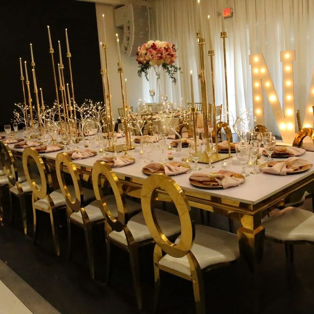Elegant banquet table with gold accents for upscale events in Utopia 305.