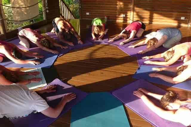 Yoga session in Horizon Hotel Santa Teresa, inviting studio for wellness retreats and team-building.