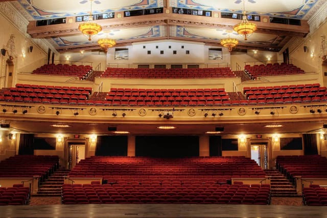 Elegant San Jose concert hall with tiered red seating for performances and events.