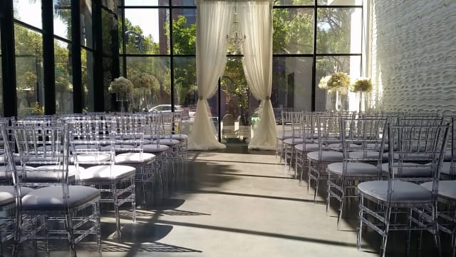 Outdoor patio at The GlassHouse with elegant Chiavari chairs, perfect for weddings and events.