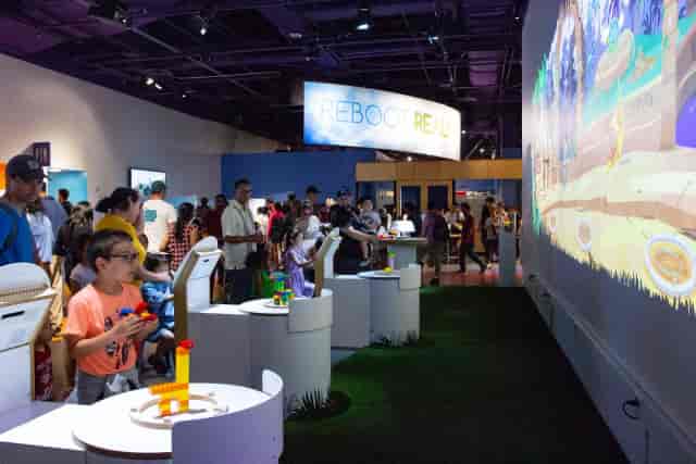 Vibrant Rooftop Terrace event space with engaged attendees and interactive displays.