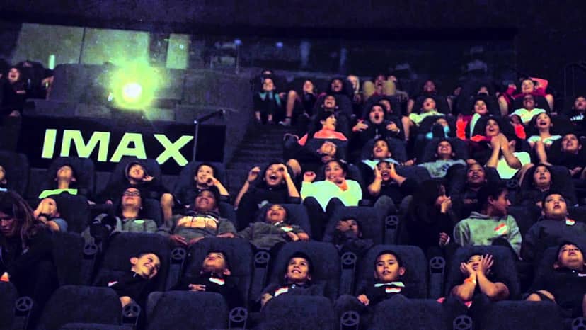 Children enjoying an IMAX movie at The Tech Interactive, perfect for events and engagements.