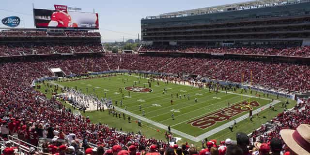 Packed Levi's Stadium during a major sporting event; ideal for corporate gatherings.