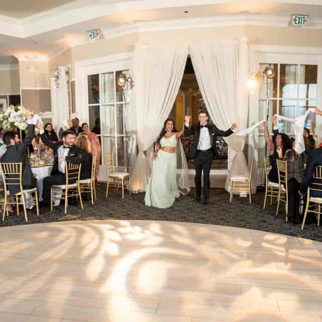 Wedding reception at San Jose Country Club with elegant decor and joyful couple.