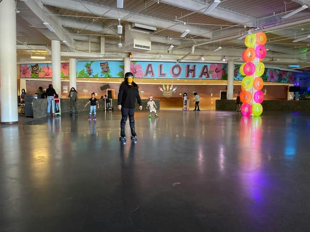 Aloha Roller Rink with vibrant decor, perfect for family-friendly events and parties.