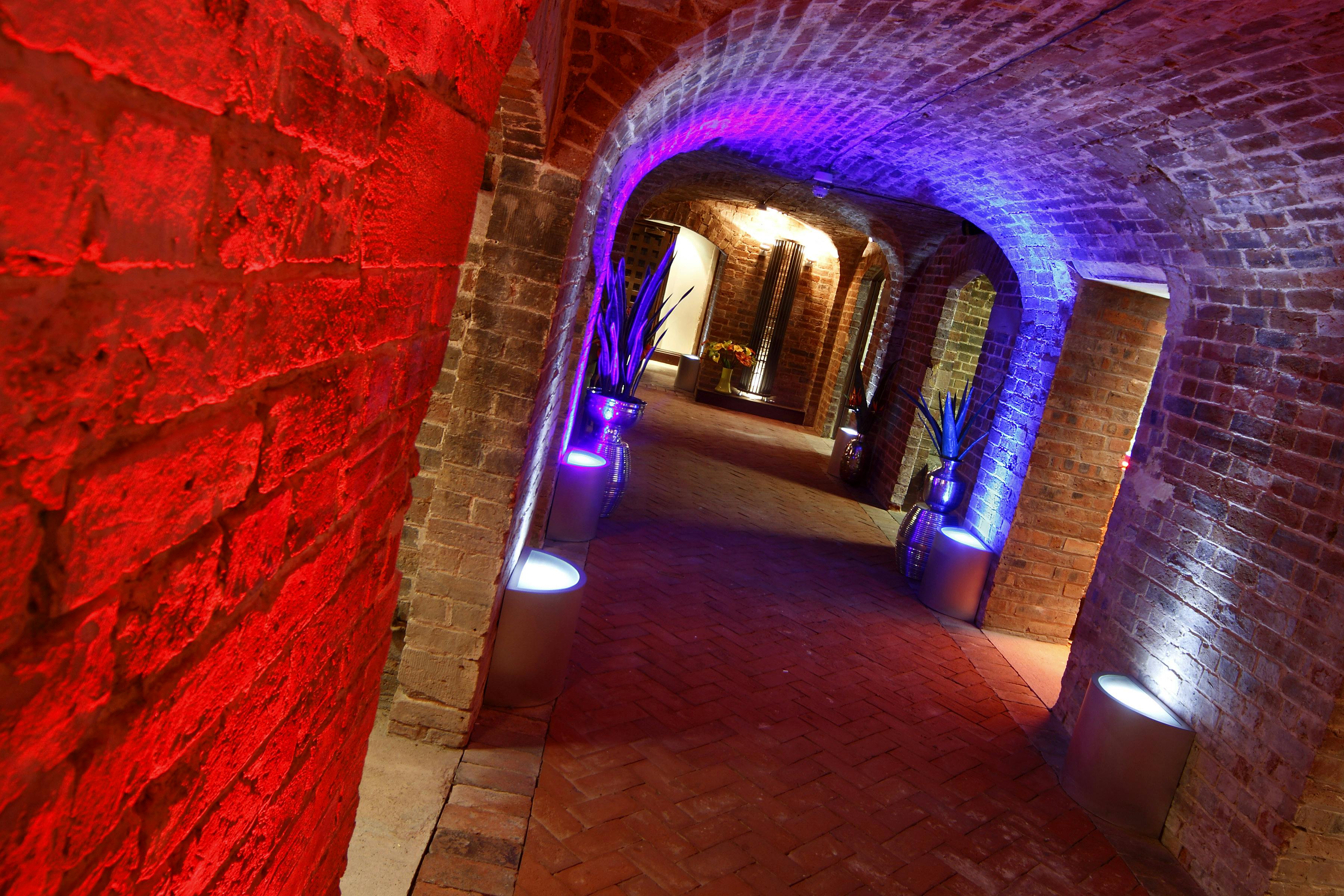 "Cellarz corridor with exposed brick, ideal for networking events and themed gatherings."
