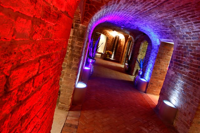 "Cellarz corridor with exposed brick, ideal for networking events and themed gatherings."