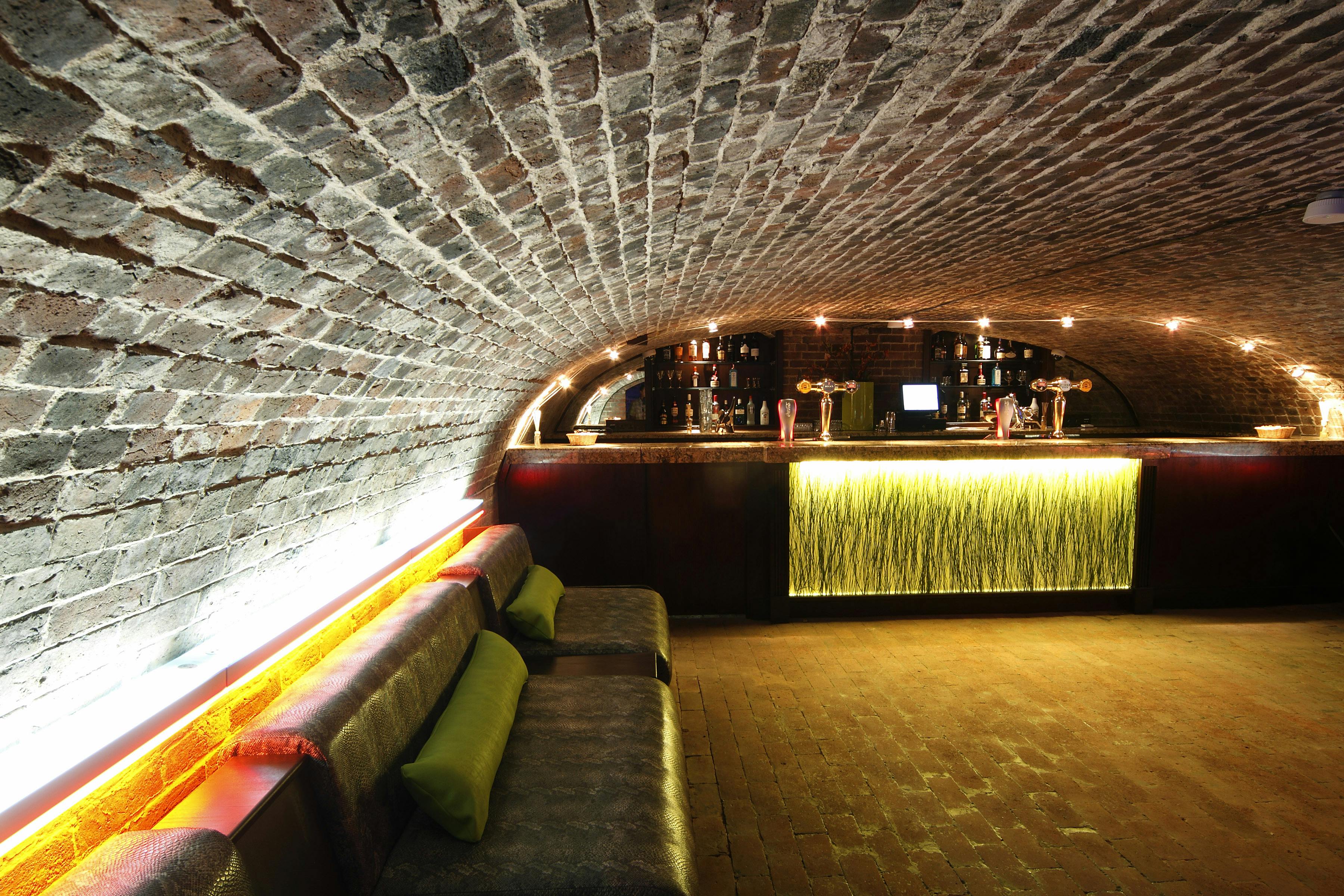 Stylish underground venue with arched brick ceiling for private events in West Midlands.