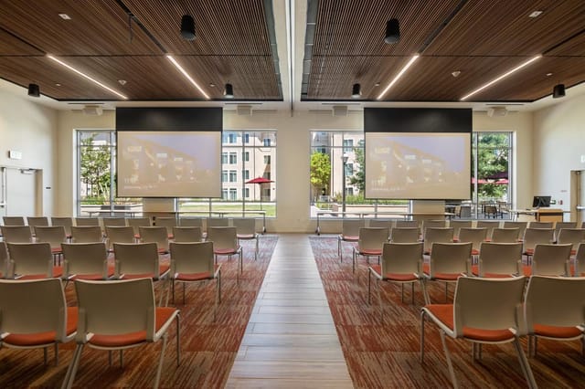 Guadalupe Hall event space with large screens, perfect for meetings and seminars.