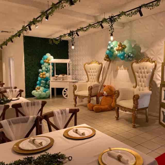 Baby shower setup in South Bay with elegant chairs and whimsical balloon decor.