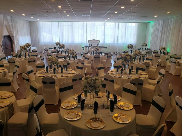 Elegant banquet hall with floral centerpieces for weddings and corporate events.