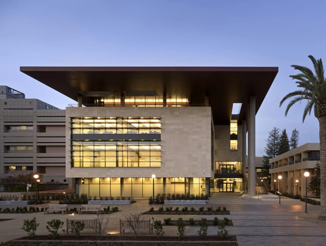 Modern conference center with glass façade, ideal for meetings and corporate events.