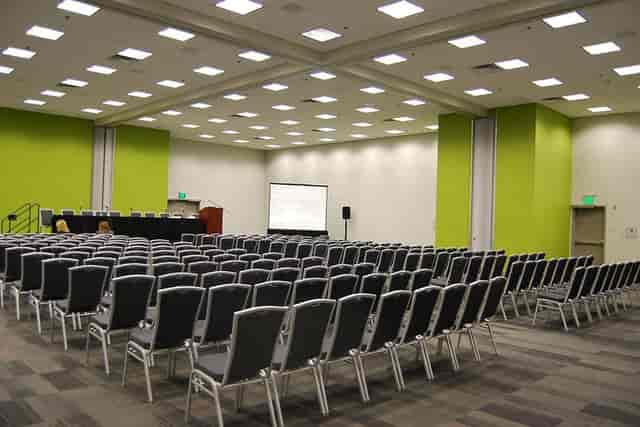 Modern ballroom in San Jose with arranged chairs for seminars and workshops.