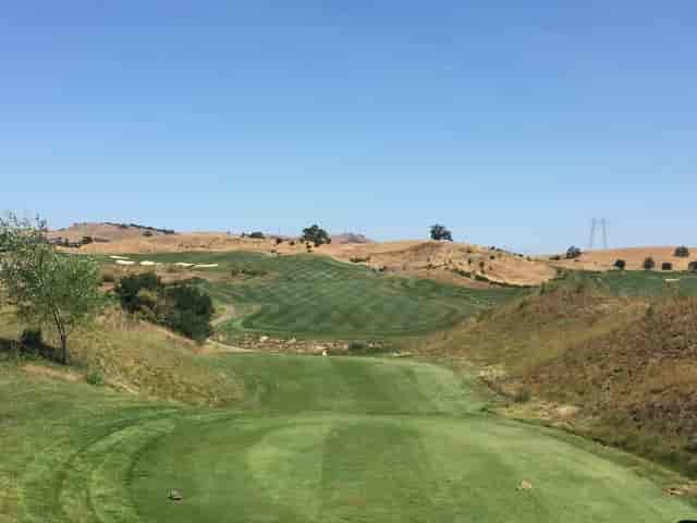 Outdoor patio at Cinnabar Hills Golf Club with scenic views for corporate outings.