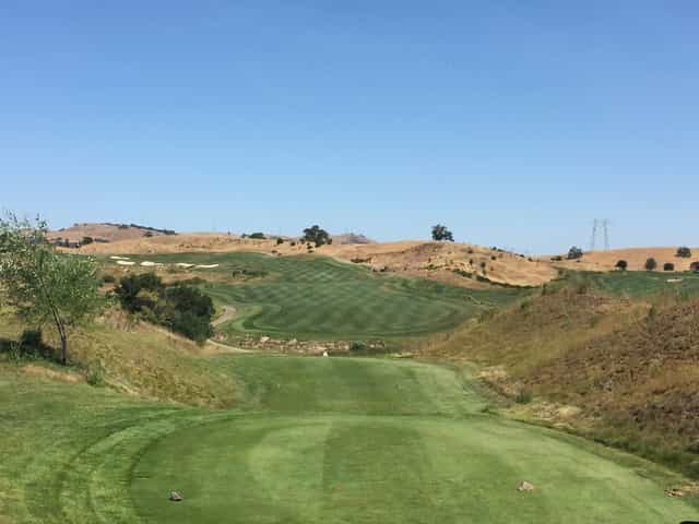 Outdoor patio at Cinnabar Hills Golf Club with scenic views for corporate outings.