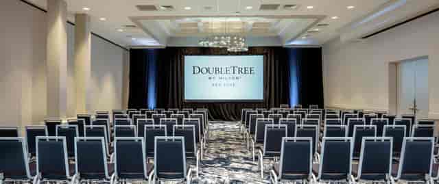 Conference room at Hilton San Jose with presentation screen - ideal for corporate events.