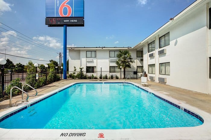 Outdoor pool area at Motel 6 Dallas, TX - perfect for casual gatherings and events.
