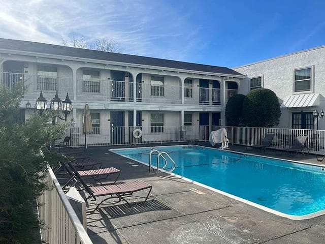 Outdoor pool area at Motel 6 Dallas, TX - perfect for casual receptions and team-building.