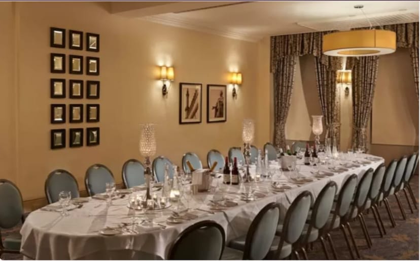Elegant banquet setup for intimate corporate dinner at The Grand Brighton.