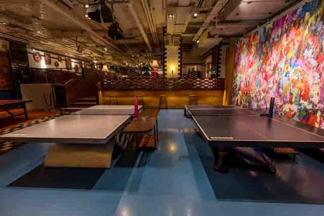 Vibrant event space with ping pong tables for networking and team-building at Bounce Farringdon.