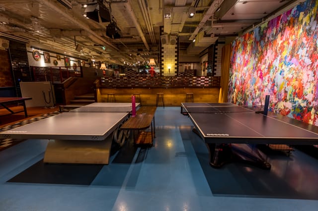 Vibrant event space with ping pong tables for networking and team-building at Bounce Farringdon.