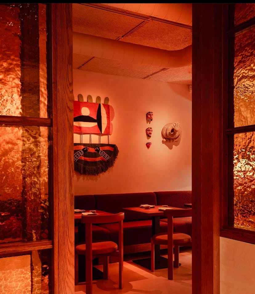 Vibrant Sala Rosa restaurant with warm lighting, ideal for intimate gatherings and events.