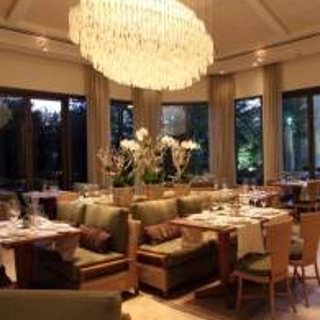 Private dining room with chandelier at Fearing's Restaurant, perfect for corporate events.