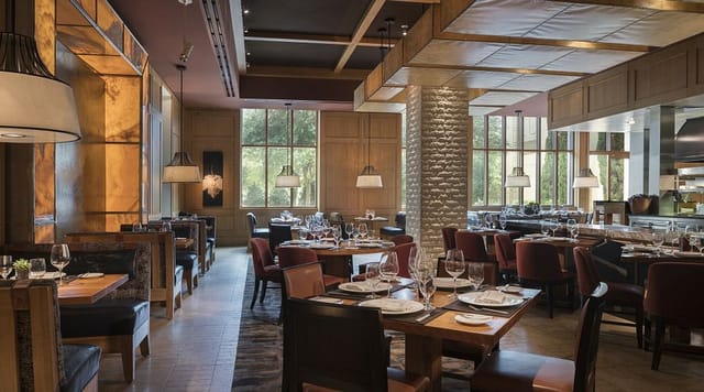 Elegant restaurant venue with warm lighting for corporate meetings and private events.