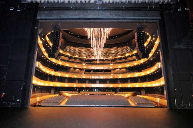 Margaret McDermott Performance Hall: elegant theater with chandelier for events and performances.