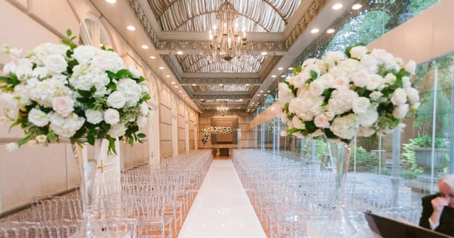 Sophisticated wedding setup in Hotel Crescent Court's Garden Room, featuring elegant floral decor.