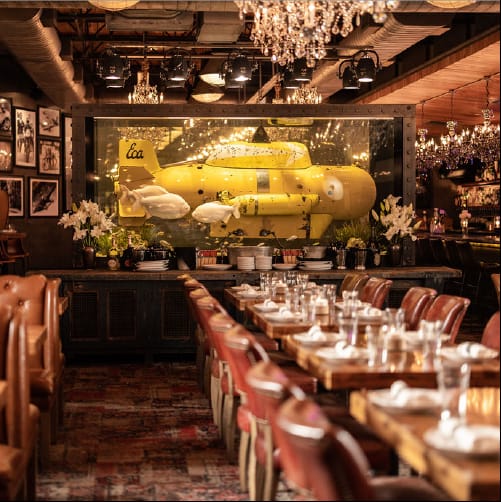 Private dining room with underwater display, ideal for themed events in Dallas.