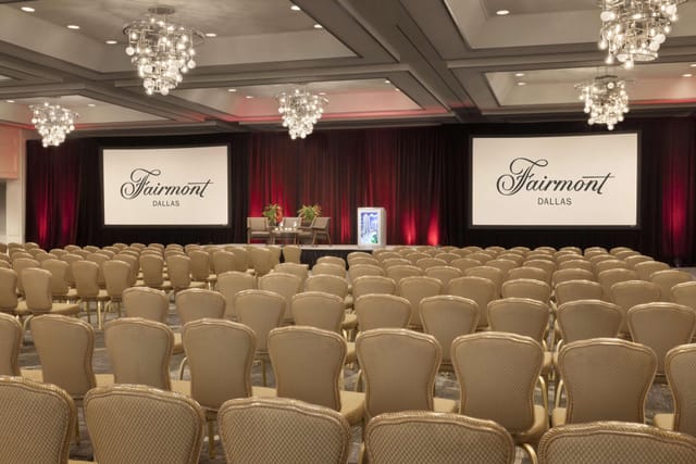 Elegant conference space at Fairmont Dallas with chandeliers, perfect for corporate events.