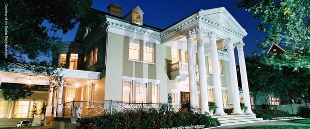 Elegant historic mansion with columns, perfect for upscale weddings and corporate events.