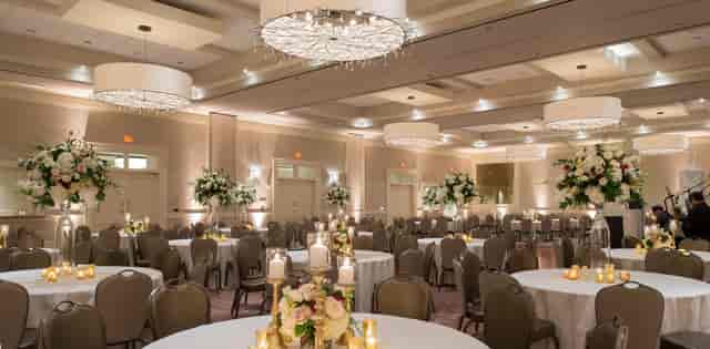 Elegant banquet hall at The Briar Club with floral centerpieces, perfect for weddings and corporate events.