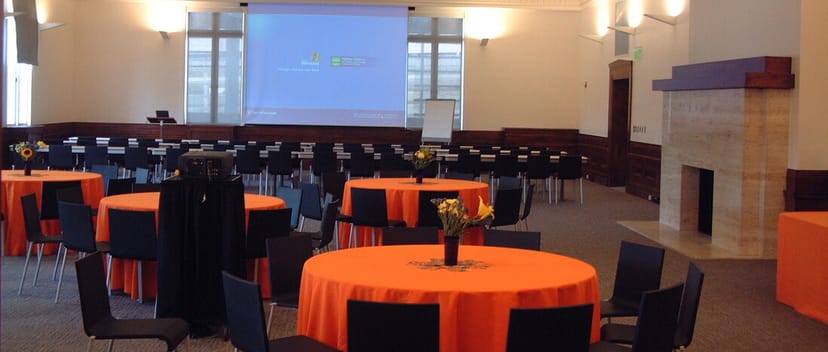 Charlie Conference Room with orange tables, ideal for corporate meetings and networking.