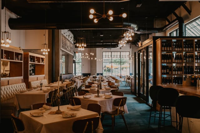 Private dining room at Ciao Bello with elegant table settings for corporate events.
