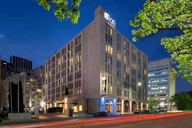 Sleek Aloft Dallas Downtown hotel facade, perfect for urban events and meetings.