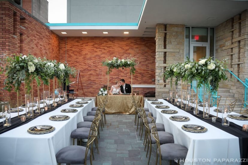 Elegant Tuscany Room with floral centerpieces for weddings and corporate events.