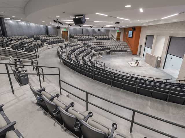Briscoe Carpenter Livestock Pavilion auditorium with tiered seating for conferences and events.
