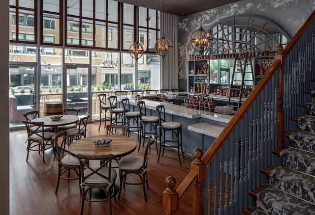 Stylish Hilton Garden Inn suite with elegant bar, perfect for meetings and events.