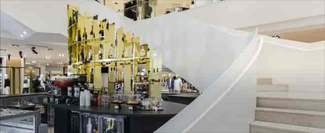 Stylish bar with modern staircase, ideal for upscale cocktail receptions and networking events.