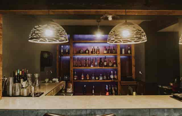 Red Room bar in Five Central Houston, featuring modern lighting for networking events.
