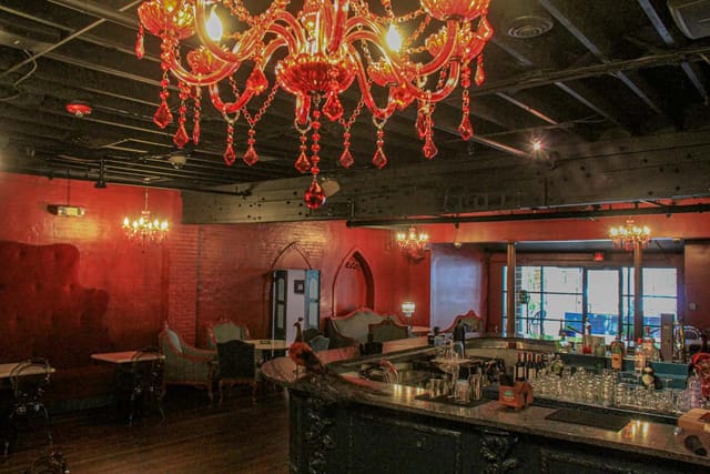 Stylish Houston event space with elegant chandeliers for cocktail receptions.
