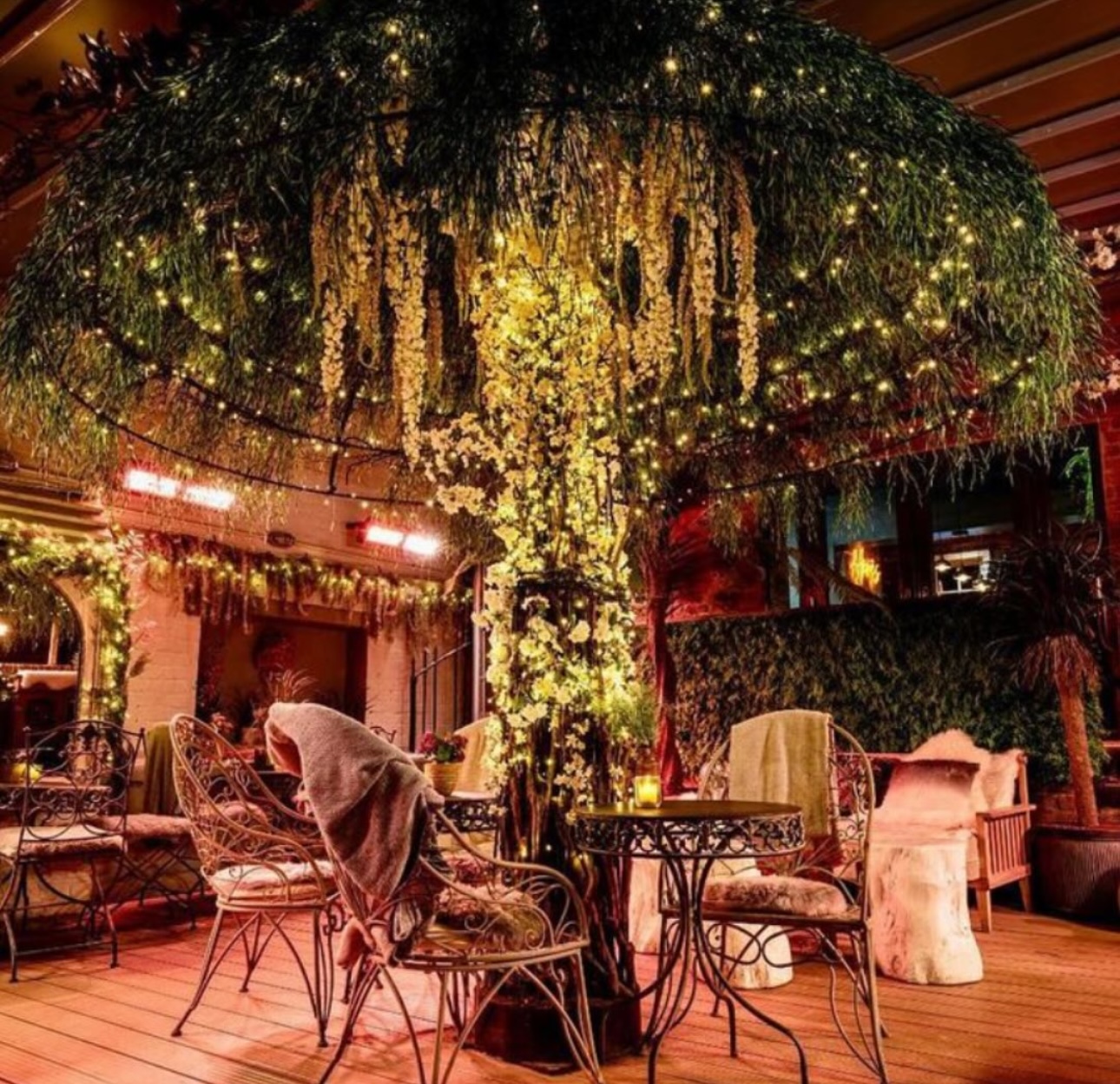 Outdoor cocktail bar with twinkling lights, perfect for weddings and private parties. - Banner